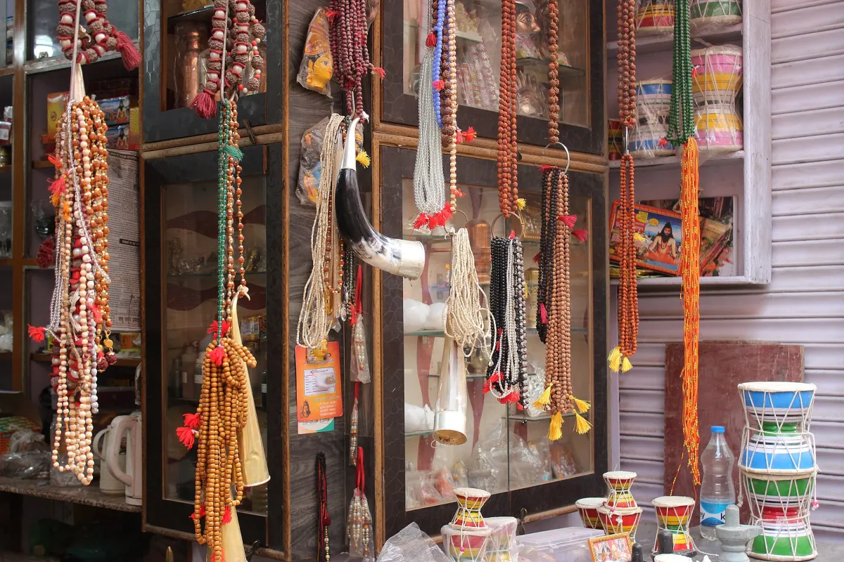 A shop in Varanasi hung with dozens of malas of rudraksha, tulsi, crystal and coloured beads