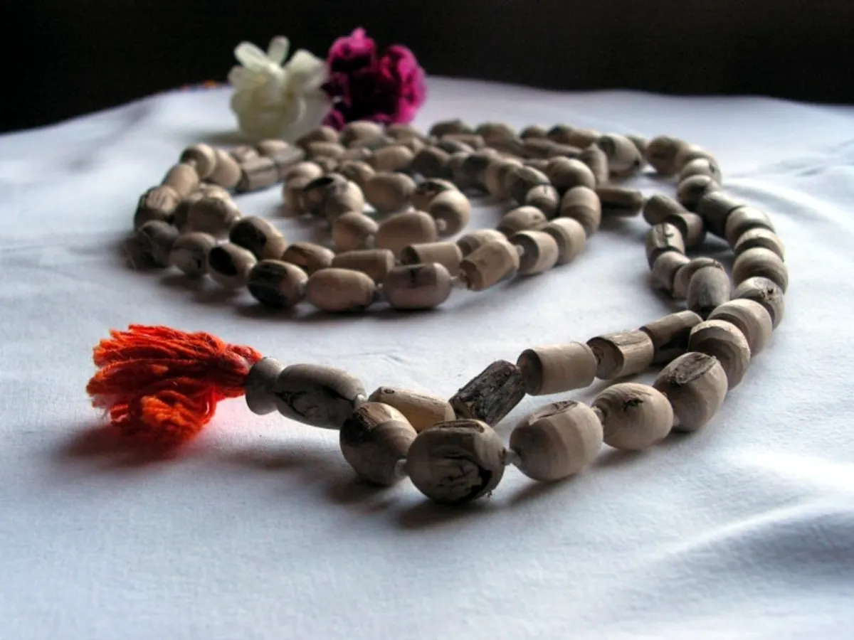A tulsi mala with its sumeru and red tassel